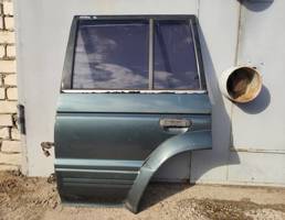 Дверь задняя левая для MITSUBISHI PAJERO/MONTERO (V1,V2,V3,V4) 1990-1997  запчасти бу
